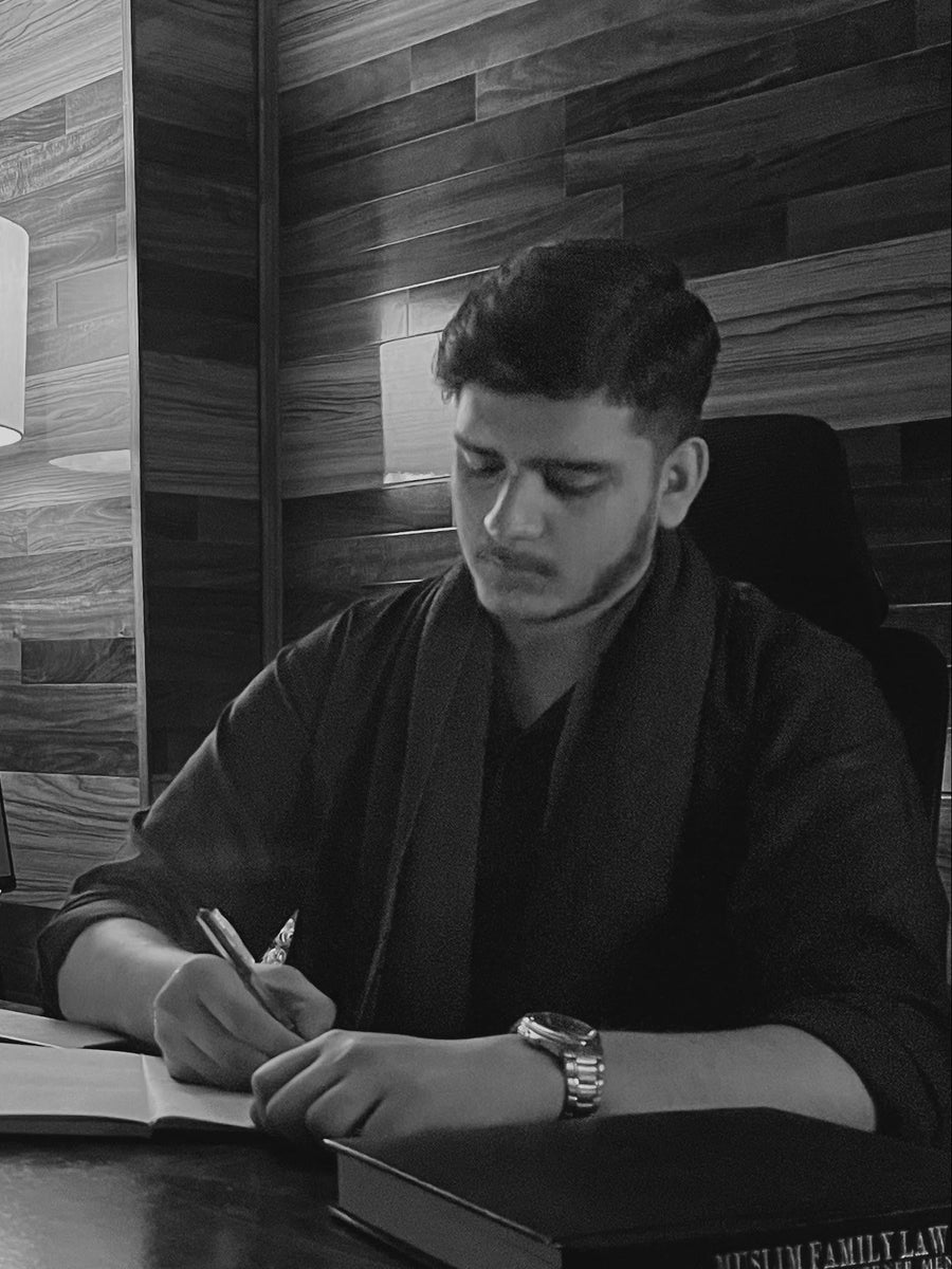 Founder writing at desk